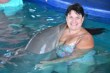 Christine with a dolphin